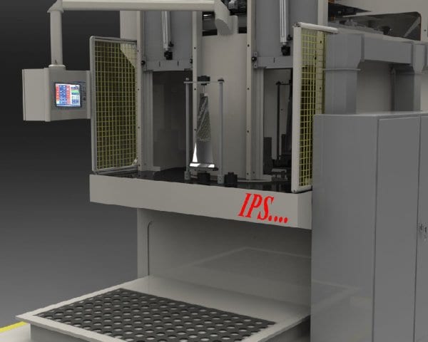HMI (top right) allows user to load this shot peening machine from a safe location during the process. The shiny metal triangle is a part awaiting transfer into the machine to be peened.